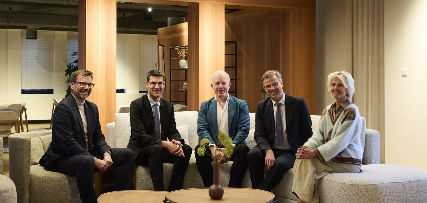 group photo of the agreement signing of CONIX RDBM Architects joining Sweco Architects, featuring Frederik Jacobs, Erwin Malcorps, Jorden Goossenaerts, Renaud Chevalier, Vicky De Bollen