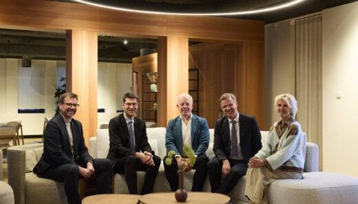 photo of Frederik Jacobs and Jorden Goossenaerts from CONIX RDBM Architects and Erwin Malcorps, Renaud Chevalier, and Vicky De Bollen from Sweco after signing the acquisition agreement