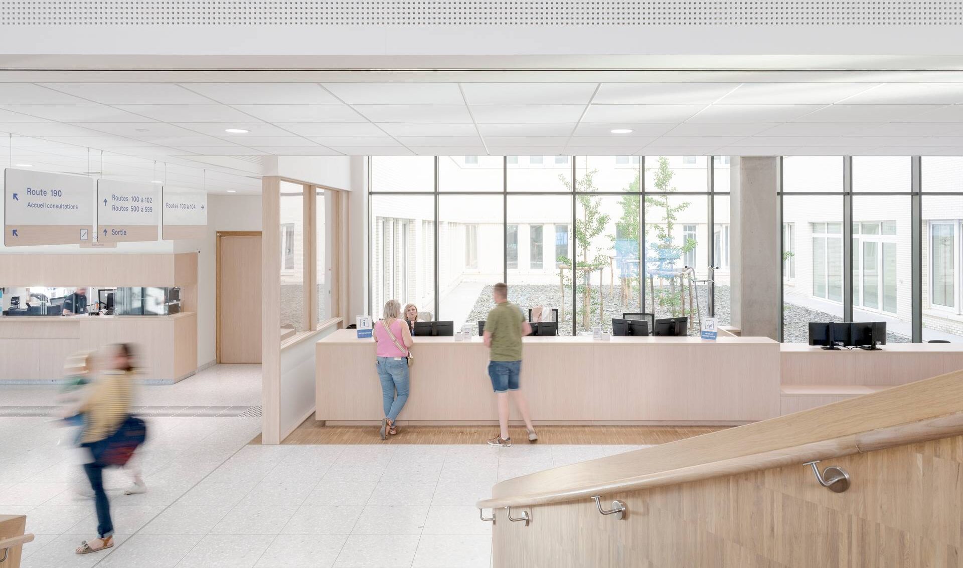 interior photo of the reception desk of the new Grand Hopital de Charleroi hospital, in abundant daylight
