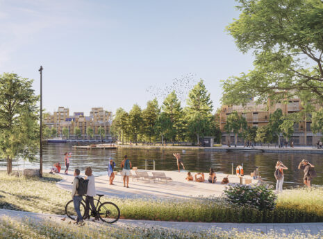 stadsbeeld aan het water met groen en mensen