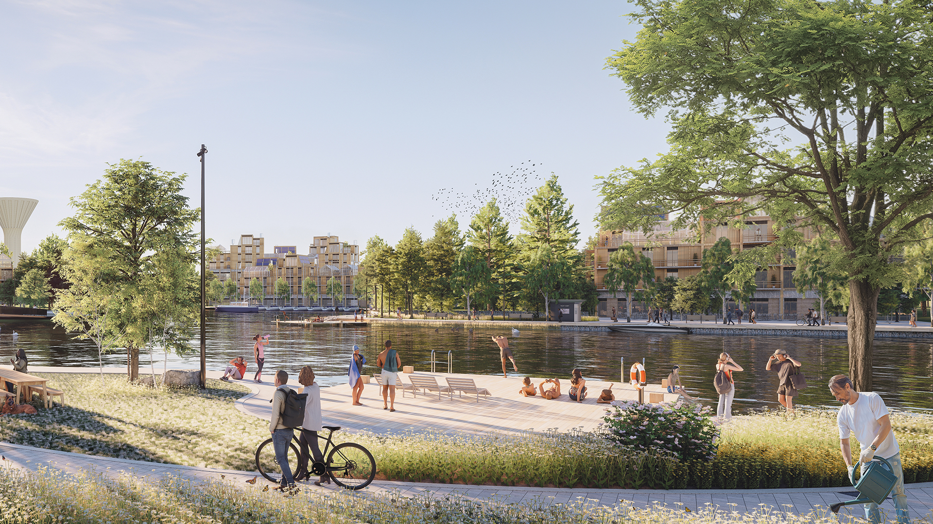 stadsbeeld aan het water met groen en mensen